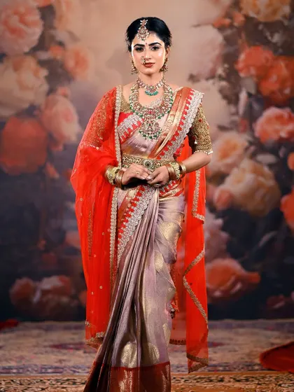 Another angle of this magnificent bridal outfit, showing the flow of the saree and the detailed craftsmanship of the jewellery.