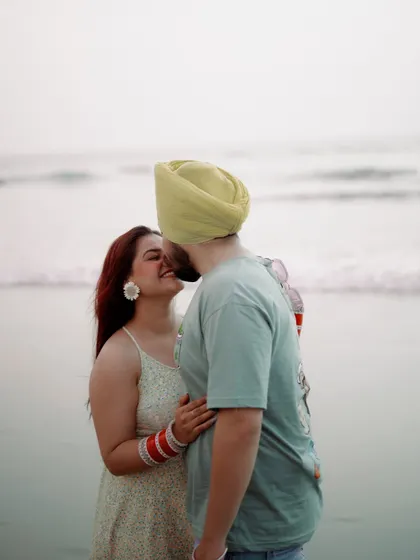 A sweet kiss filled with laughter. These unposed, genuine interactions make for the most cherished photographs from a pre-wedding or post-wedding shoot.