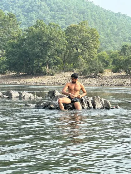 Sitting on the rocks, this shot has a candid and authentic feel.