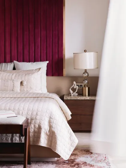 Another artistic shot of the master bedroom, focusing on the elegant details and luxurious materials.