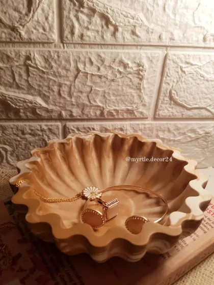 Our new floral bowl in a 'Mocha Mousse' marble finish. The wavy edges and warm, earthy tones make it a stunning centerpiece or jewelry bowl.