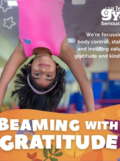 Going upside down is a thrill. This preschooler is practicing a supported handstand, building strength, body awareness, and the confidence to see the world from a different angle.