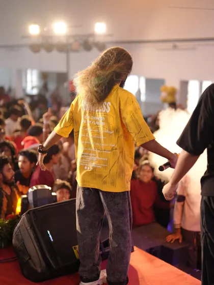 A view from behind, showing my signature long hair and my connection with the audience.