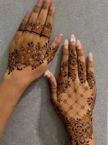 An example of two different contemporary styles. One hand has a floral and line-work design, while the other features a floral net pattern.
