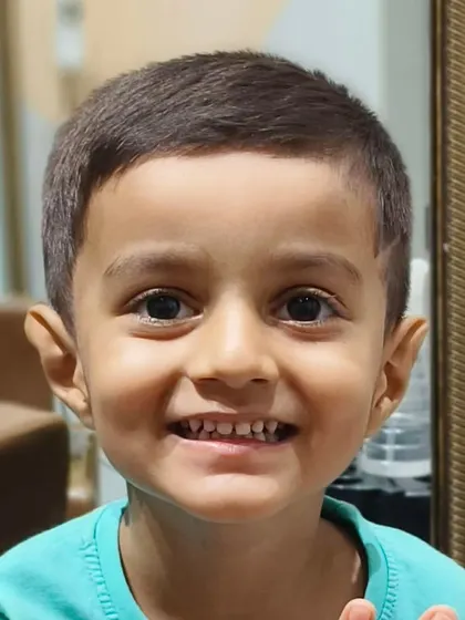 This little guy is all smiles after getting his fresh new haircut at our salon.