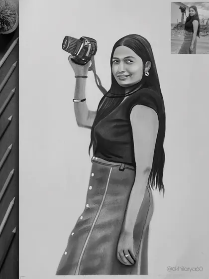 A great A3 graphite sketch for a photography lover. I included her camera in the portrait to make it more personal and reflective of her passion.