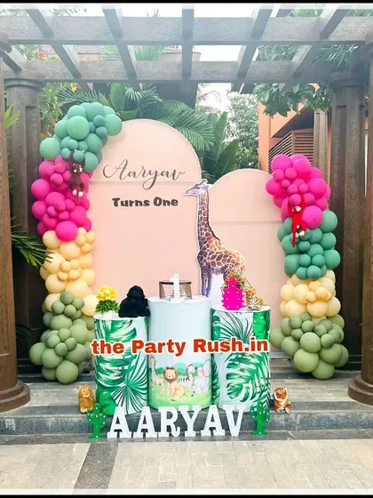Aaryav's outdoor "Wild One" party was set against a beautiful natural backdrop. I used bright, tropical-colored balloons and jungle-themed props to create a vibrant and fun atmosphere that stood out among the greenery.