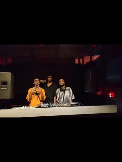 Behind the decks with fellow artists. I often collaborate with other DJs and MCs to create a dynamic and engaging show.