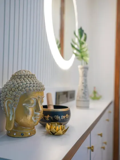A close-up on the decor that sets a peaceful mood for this home's entrance.