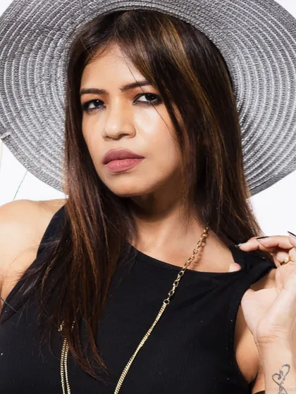A close-up beauty shot, focusing on the model's expression.