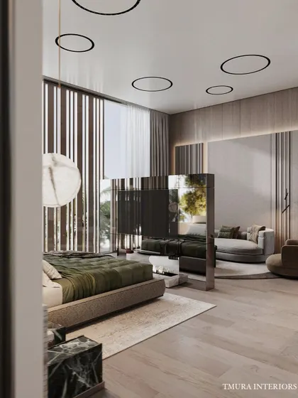 This angle of the bedroom highlights the seating area with its curved chaise lounge. The rotating TV unit is positioned to be viewable from both the bed and the lounge area, showcasing our focus on practical luxury.