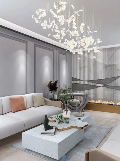 An overview of the living room, highlighting the balance between classic architectural details and modern furnishings. The leaf-like chandelier and abstract art add a contemporary, artistic flair.