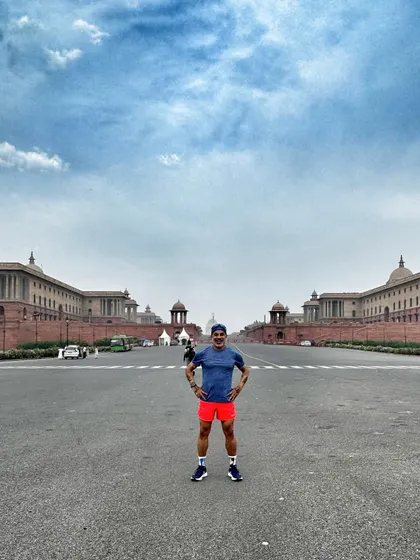 A runner standing proud after a great workout in the heart of New Delhi. We train in some of the most inspiring locations our city has to offer.