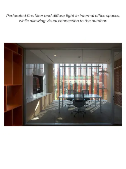 Perforated fins on the facade of the JSW Vijayanagar office filter and diffuse sunlight into a meeting room. This strategy allows for glare-free natural light and maintains a visual connection to the outdoors.