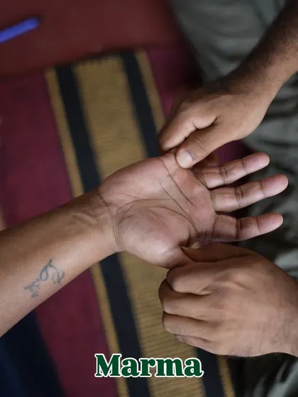 This is Marma therapy in action. I am showing a participant how to activate a specific pressure point in the hand. Learning these points gives you the power to manage your own well-being.