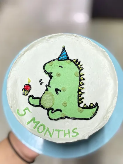 Another angle of the 5-month celebration cake, ready for some smashing fun.