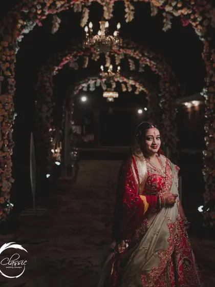 A bride's moment in the spotlight. This tunnel of floral arches and chandeliers, which I designed for a resort wedding, also serves as a stunning backdrop for bridal portraits.
