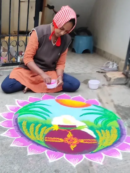 Here I am, adding the final touches to my Pongal rangoli. It's a labor of love.