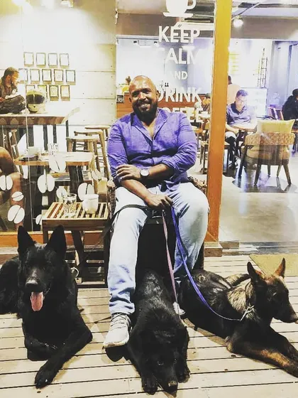 This is the end goal. Enjoying a coffee in public, completely relaxed, with my squad of powerful, trained dogs at my feet. They aren't anxious or reactive; they are calm companions. This is the freedom and partnership that comes from real training and clear leadership.