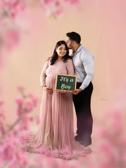 A sweet gender reveal moment. The "It's a Boy" chalkboard sign is a wonderful way to share the exciting news during your maternity shoot.