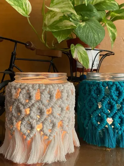 Our macrame mason jar covers are a versatile decor piece. You can use them as a candle holder for a cozy glow, or as a stylish vase for flowers or pens.