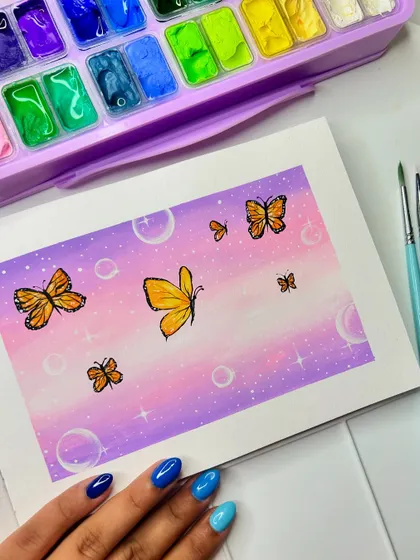 Another shot of the finished butterfly gouache painting, showing off my nail art that matches the colors!