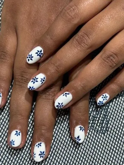 Another shot of the beautiful porcelain-inspired floral nails. The hand-painted pattern is delicate and precise.