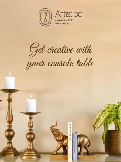 Get creative with your console table. Here, I've combined our classic candle stands with elephant bookends and a planter to create a balanced and interesting display.