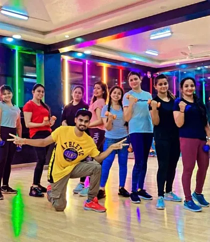 Our 7 PM Zumba batch showing off their strength with some dumbbell exercises. We incorporate light weights to tone muscles and enhance the workout.
