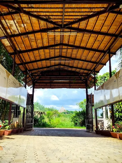 A view of the Vishalakshi Mantap perfectly framed by a bamboo gateway. Every path on campus is designed to lead you through nature's beauty.