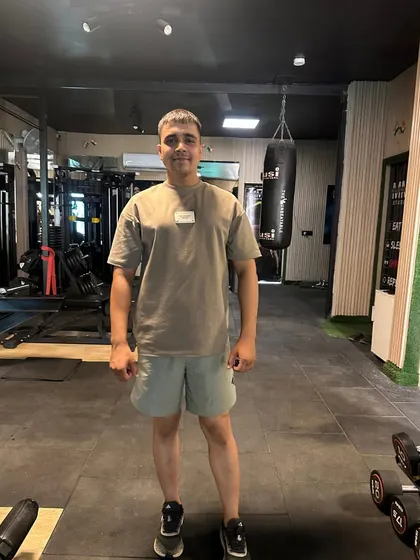 A simple standing pose in the gym.