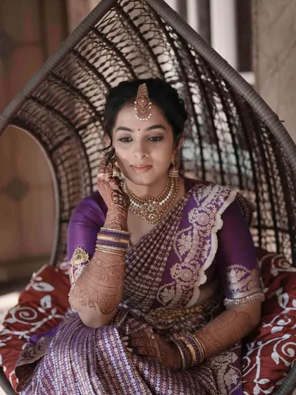 Another beautiful shot from the engagement series, capturing the bride's gentle smile and the timeless quality of her makeup.