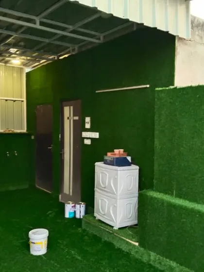 The complete view of the room with artificial grass walls and flooring. It's a testament to the versatility of the material.