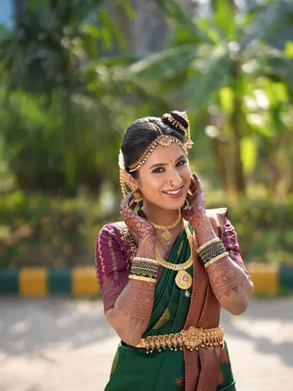 A joyful shot of the bride. The makeup is fresh and radiant, with a focus on a happy, healthy glow.