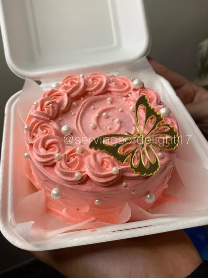 A duplicate of image 15, this pink bento cake is a perfect example of the delicate work I love doing for special occasions like Mother's Day.
