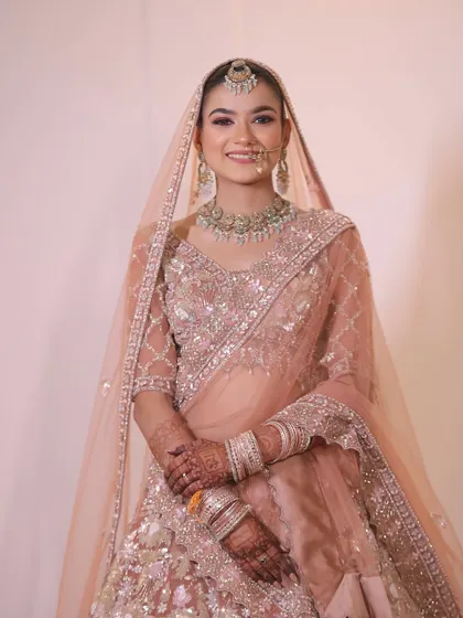 An effortlessly gorgeous portrait of my bride Shweta. The soft pink lehenga is complemented by a fresh, dewy makeup look perfect for a sundowner wedding.