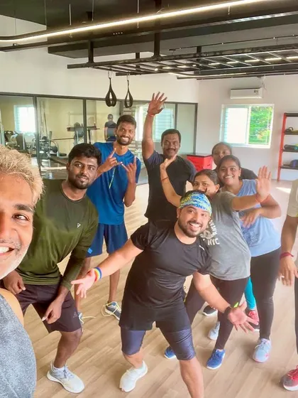 Waving goodbye after another amazing class. The camaraderie and shared energy make every session special.