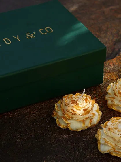 A set of three delicate peony candles, shown with my signature green gift box. These small, intricate floral candles are perfect for adding a touch of beauty to any gift.