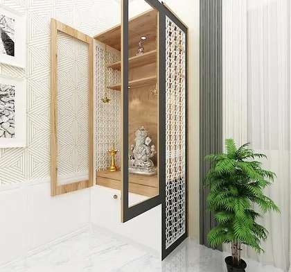 Another view of the modern pooja unit, showing the detailed jali work on the doors which allows light to filter through, creating a peaceful ambiance.