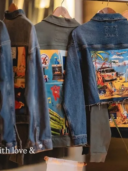 Another view of the custom wedding jackets hanging on the rack.
