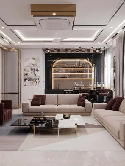 This angle reveals the integrated bar area at the back of the drawing room, showcasing how I design multi-functional living spaces perfect for entertaining. The coffered ceiling with strip lighting adds to the modern luxury feel.