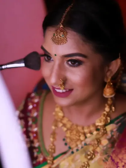 A behind-the-scenes moment, applying the finishing touches for Rachana's muhurtham look. I take care with every detail to ensure perfection.