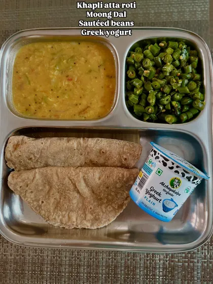 A comforting meal of khapli atta roti, moong dal, sautéed beans, and Greek yogurt. It's about eating right and eating enough, never starving yourself.