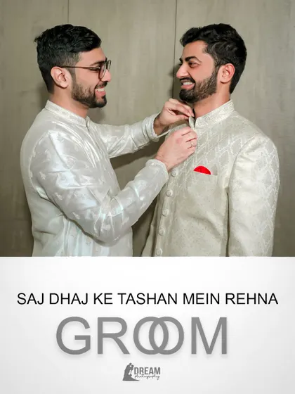 "Saj Dhaj Ke Tashan Mein Rehna." A fun shot of the groom getting help with his outfit from his groomsman.