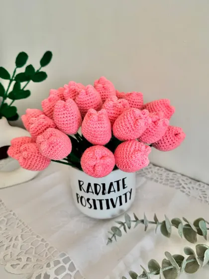 An arrangement of lovely pink crochet tulips that will never wilt. These are perfect for Mother's Day, anniversaries, or as a permanent floral display in your home.