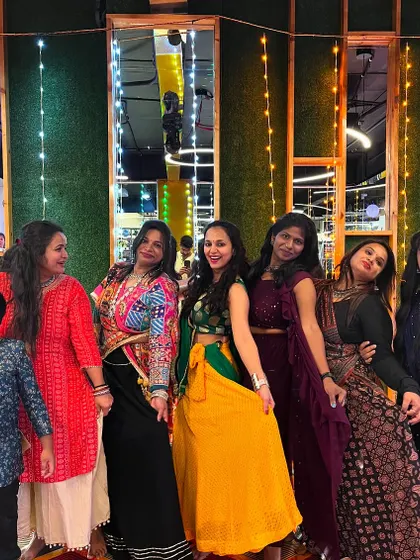 Posing with my students after a successful Garba session. Everyone is dressed in festive attire, capturing the celebratory spirit of the event.