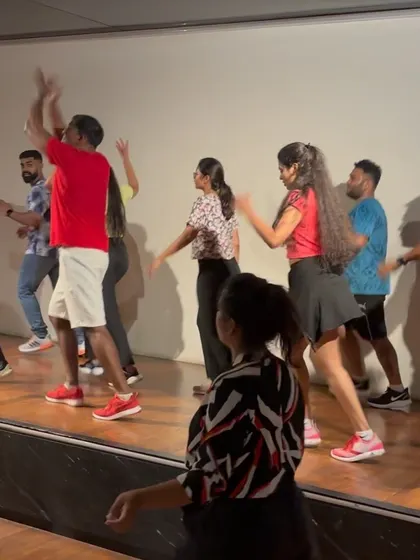 The energy is infectious! More participants joining in on stage.