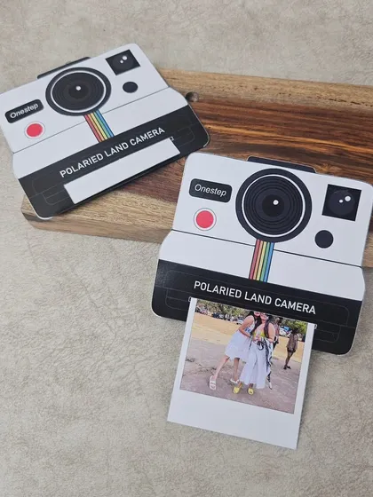 Another shot of the polaroid-style pull-up card, showing its unique design and nostalgic appeal.