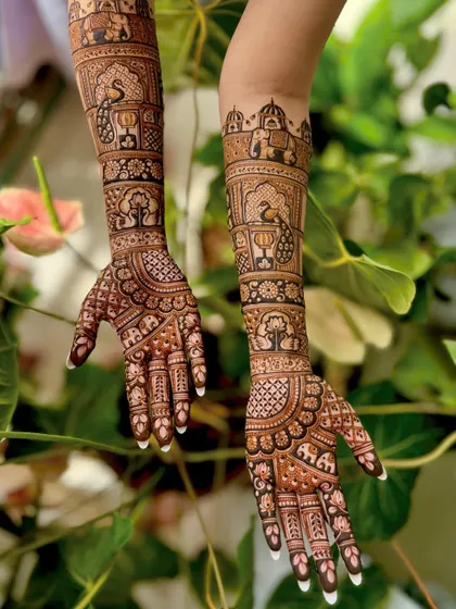 An angled shot showing the beautiful flow of the design from the palms to the elbows.