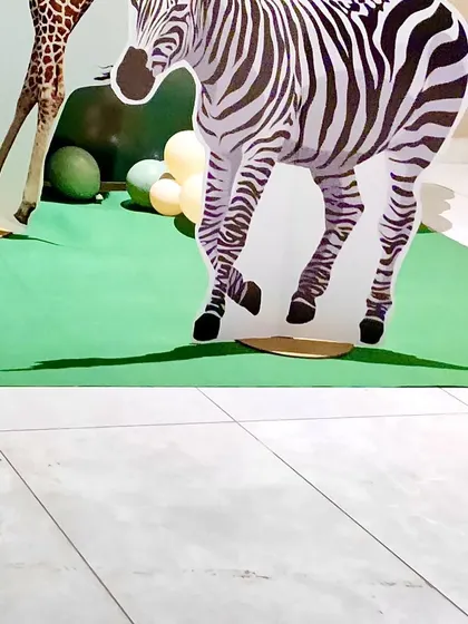A life-sized zebra cutout prop, which adds a big visual impact to the safari theme.